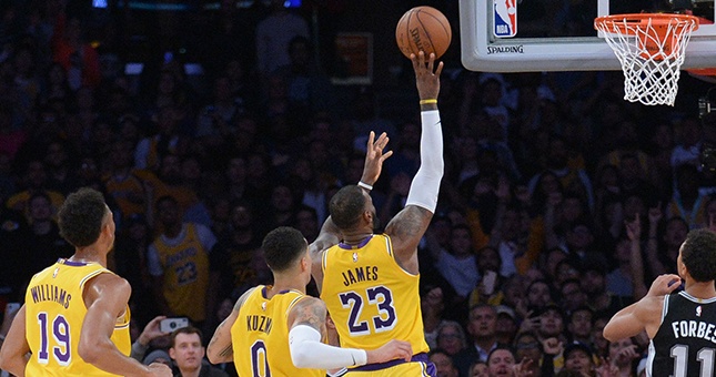 Los Angeles Lakers forward LeBron James (23) shoots against the San Antonio Spurs during overtime at Staples Center.