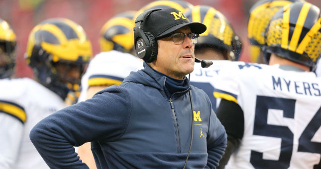 Michigan head coach Jim Harbaugh looks up at the scoreboard during the second quarter against Ohio State.