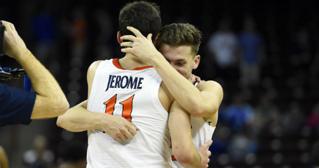 Virginia guards Kyle Guy (5) and Ty Jerome (11) embrace after defeating Oklahoma in the second round of the 2019 NCAA Tournament.