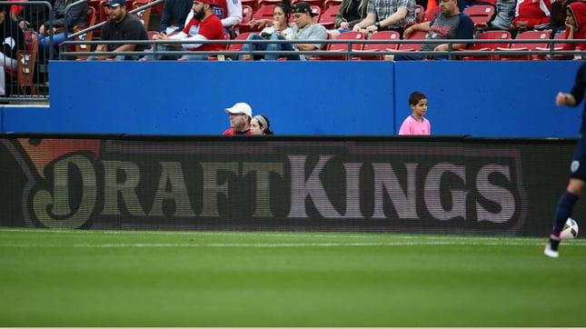 DraftKings is attempting to raise a $2 billion valuation in preparation of going public, according to a report Wednesday.