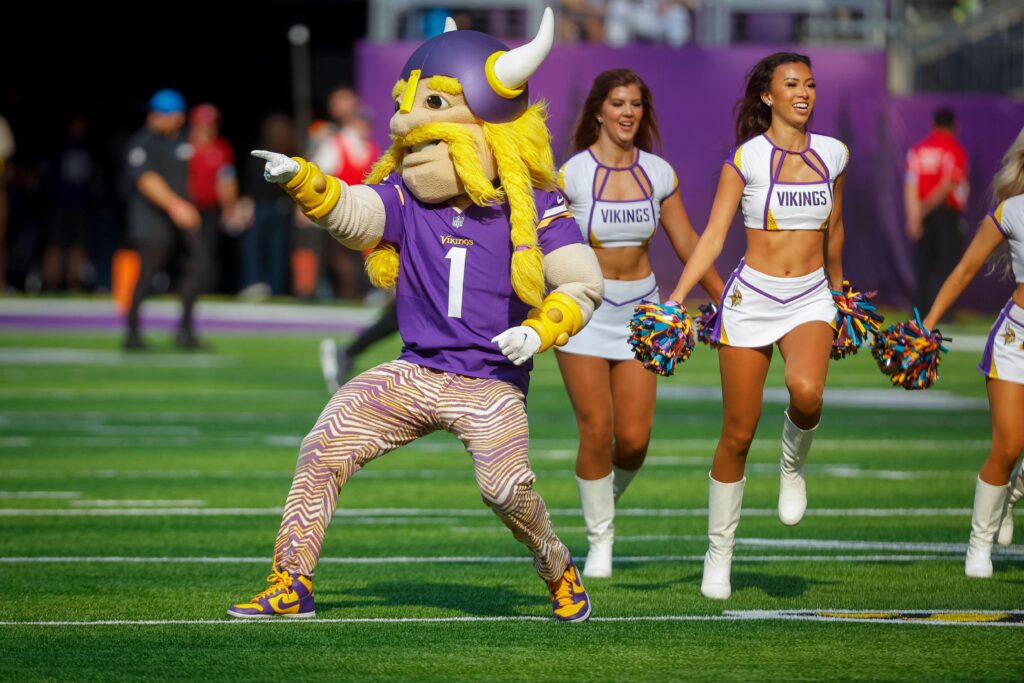 Minnesota Vikings mascot Viktor the Viking and the cheerleader (AP Photo)