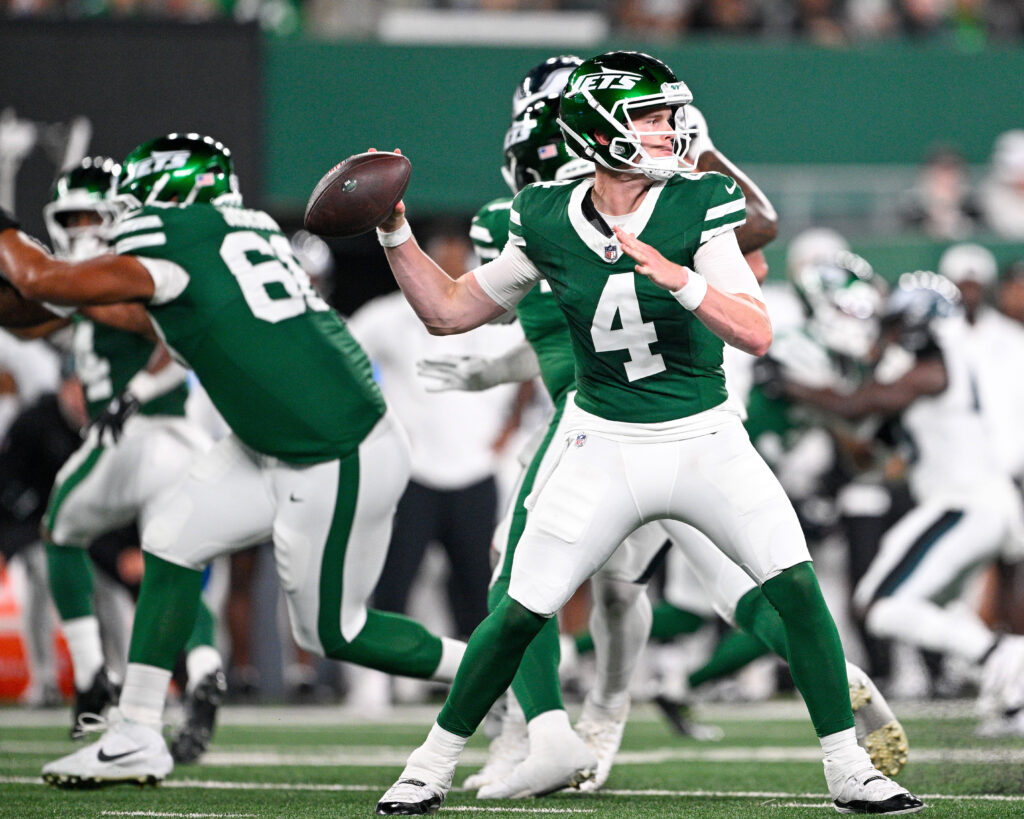 New York Jets quarterback Brady Cook (4) looks to pass the ball