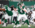 New York Jets quarterback Brady Cook (4) looks to pass the ball