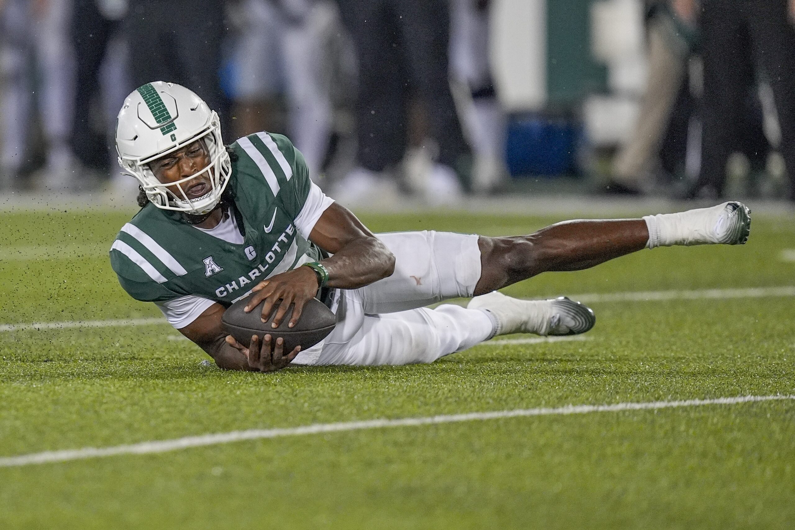 Sep 6, 2025; Charlotte, North Carolina, USA; Charlotte 49ers quarterback Conner Harrell (15) chases a fumbled snap