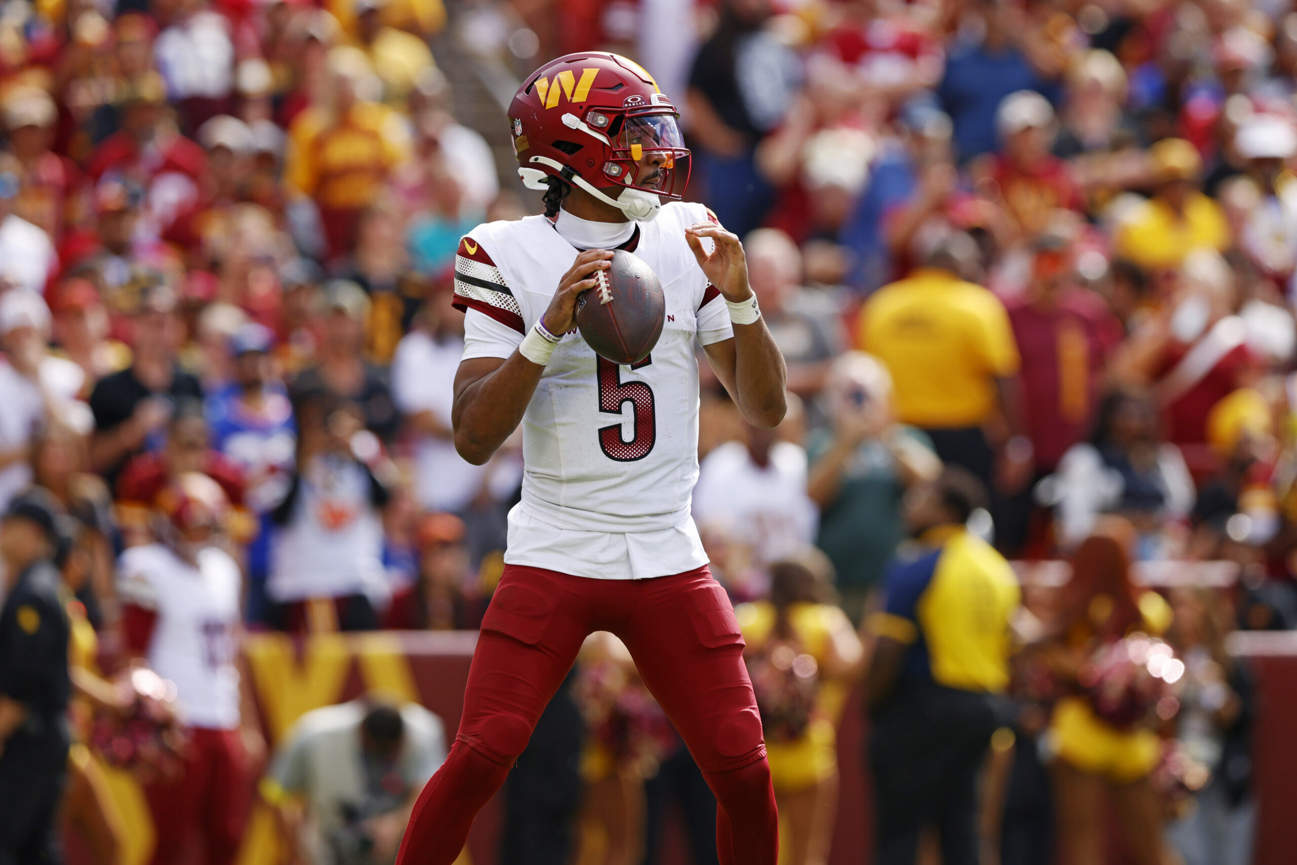 Sep 7, 2025; Landover, Maryland, USA; Washington Commanders quarterback Jayden Daniels (5) makes a pass during the fourth quarter against the New York Giants at Northwest Stadium. Mandatory Credit: Peter Casey-Imagn Images