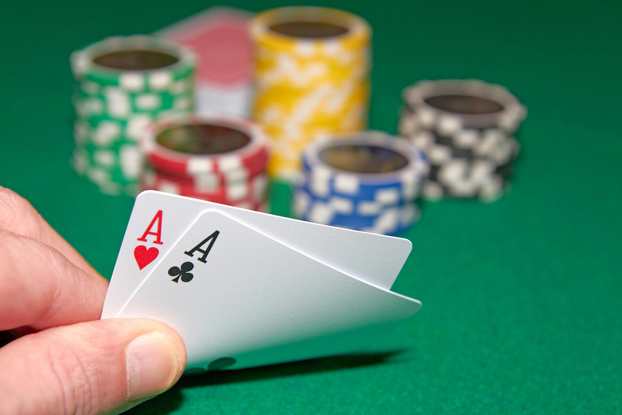 Casino Poker Table with a hand of two aces and a stack of chips