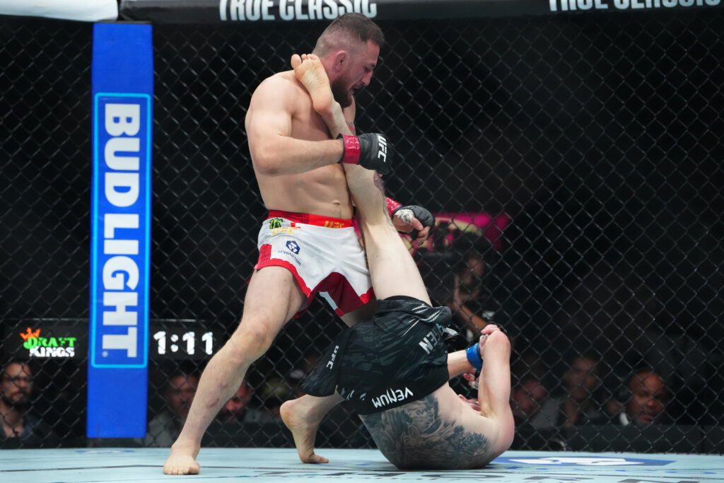 Merab Dvalishvili (red gloves) fights