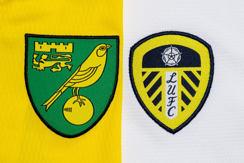 Close up of Norwich City and Leeds United club crests