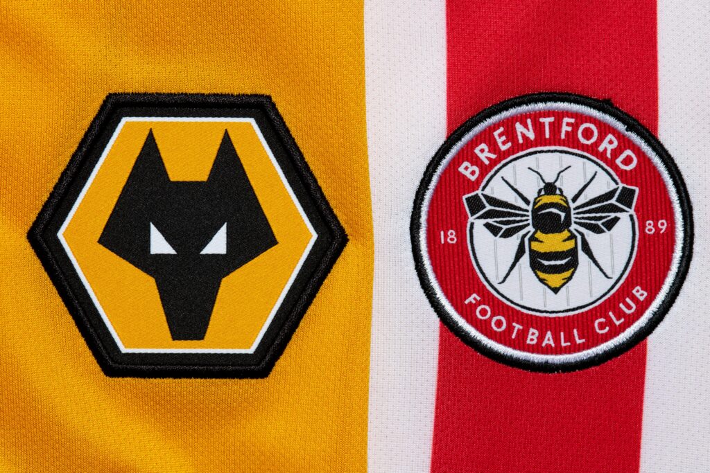 Close up of Wolves and Brentford football club crests