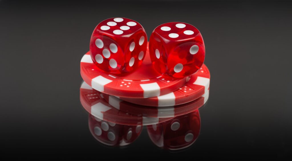 Red dice and casino chips